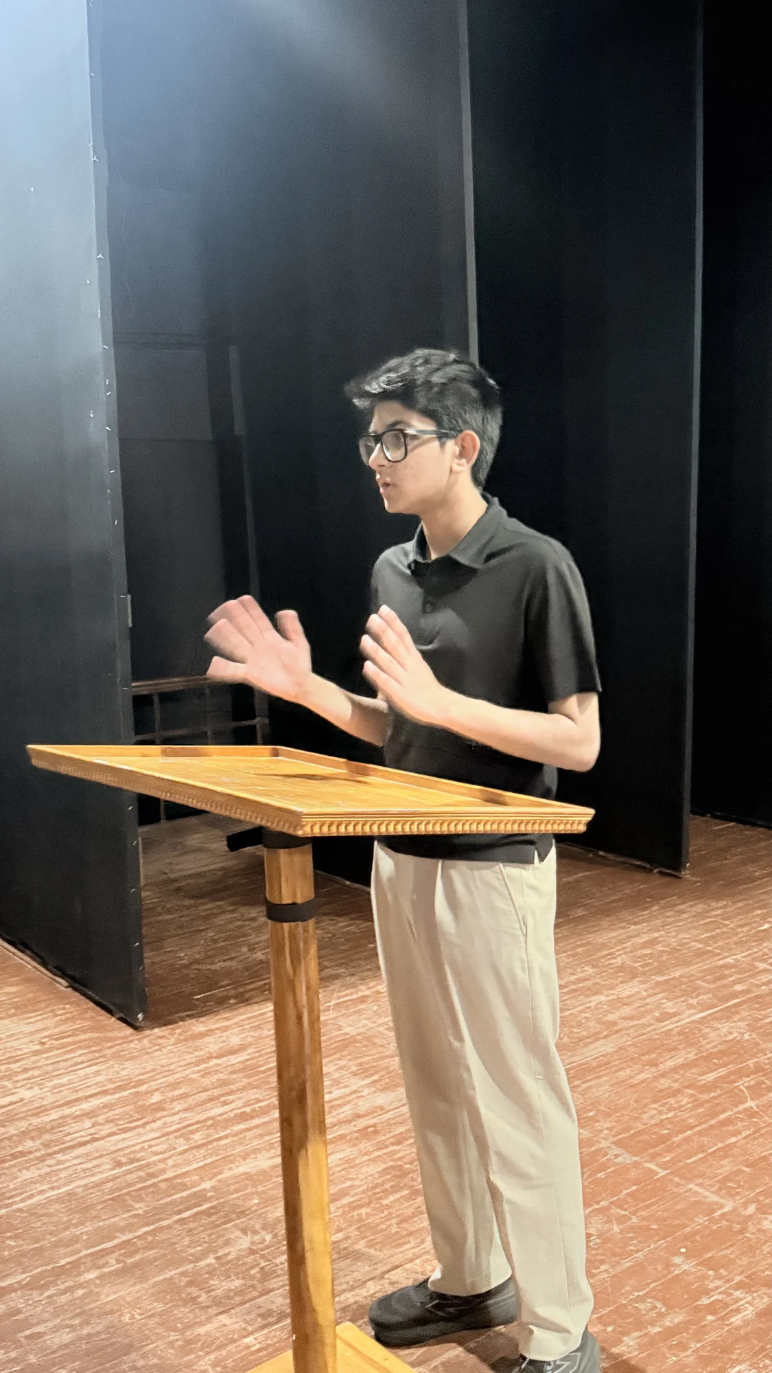 Aarav Doshi speaking at a lectern