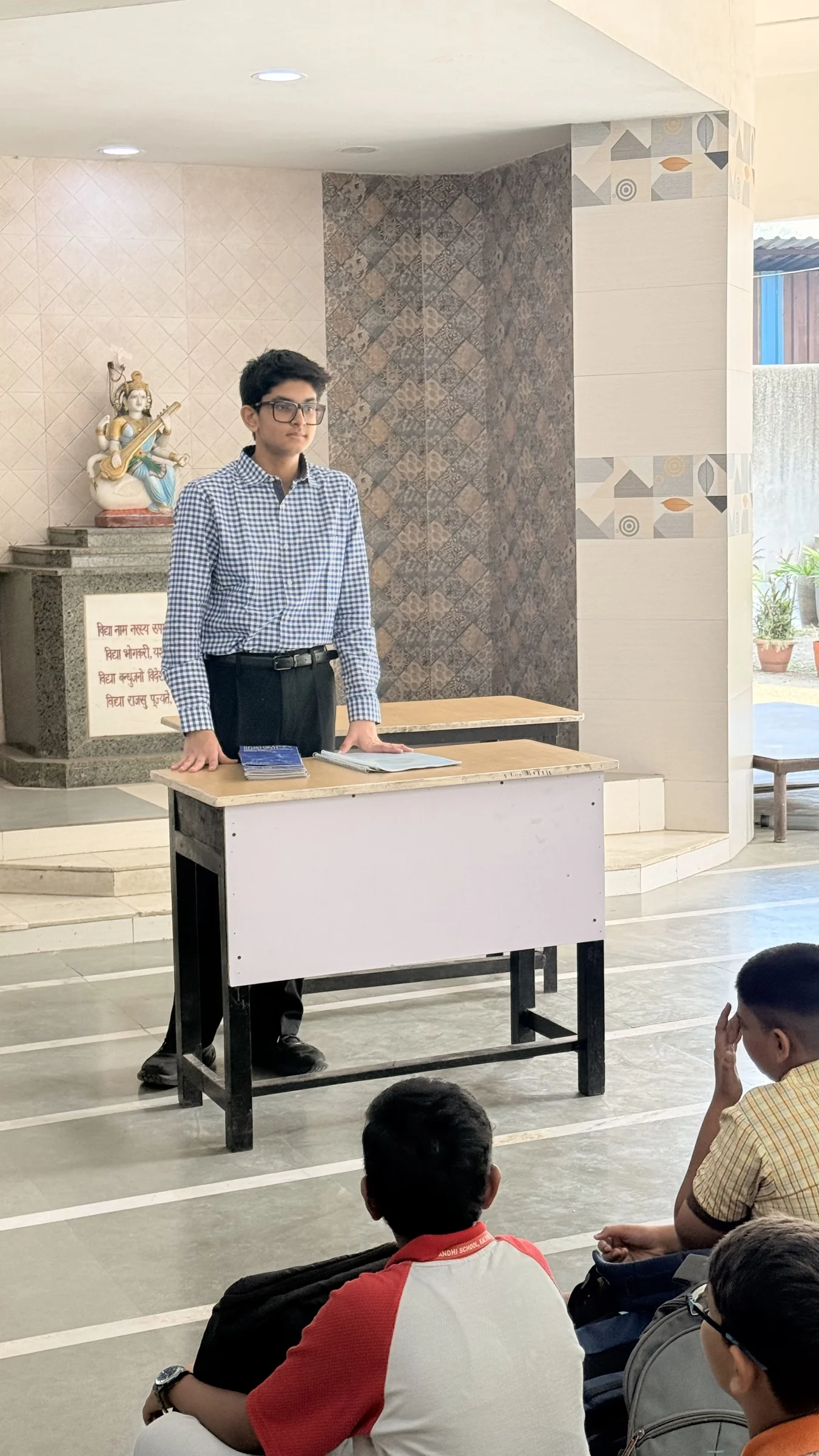 Aarav explaining a science topic to students