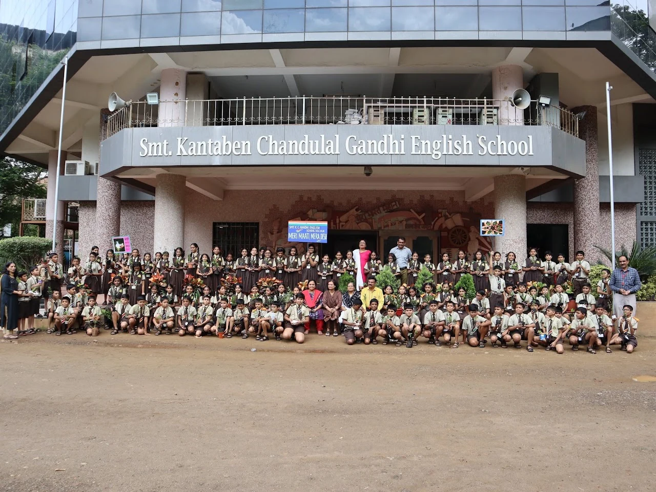 Students and staff gathered outside Smt. Kantaben Chandulal Gandhi English School