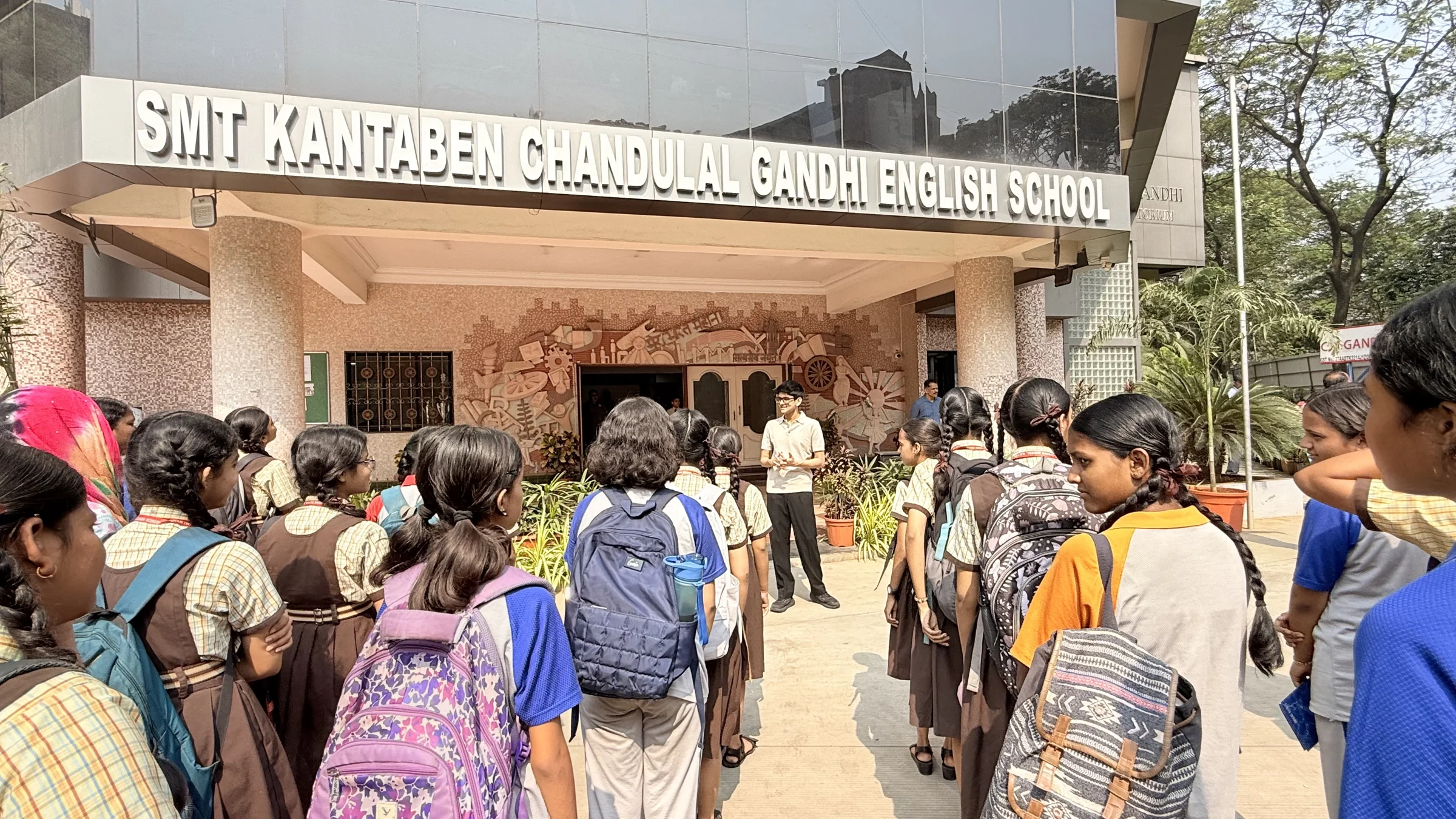 Students and teachers gathered outside KC Gandhi School