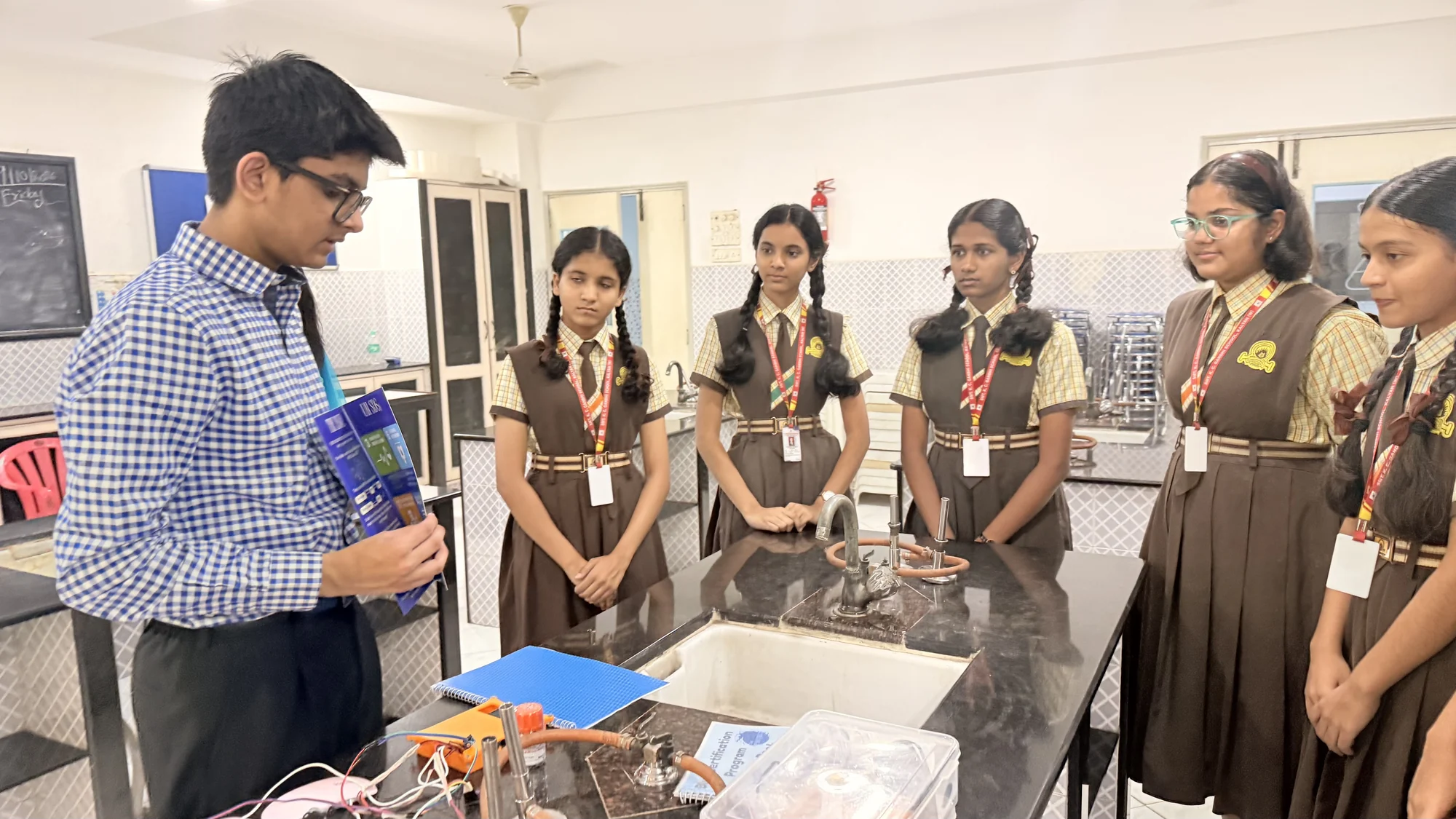 School students watching a hands-on laboratory demonstration